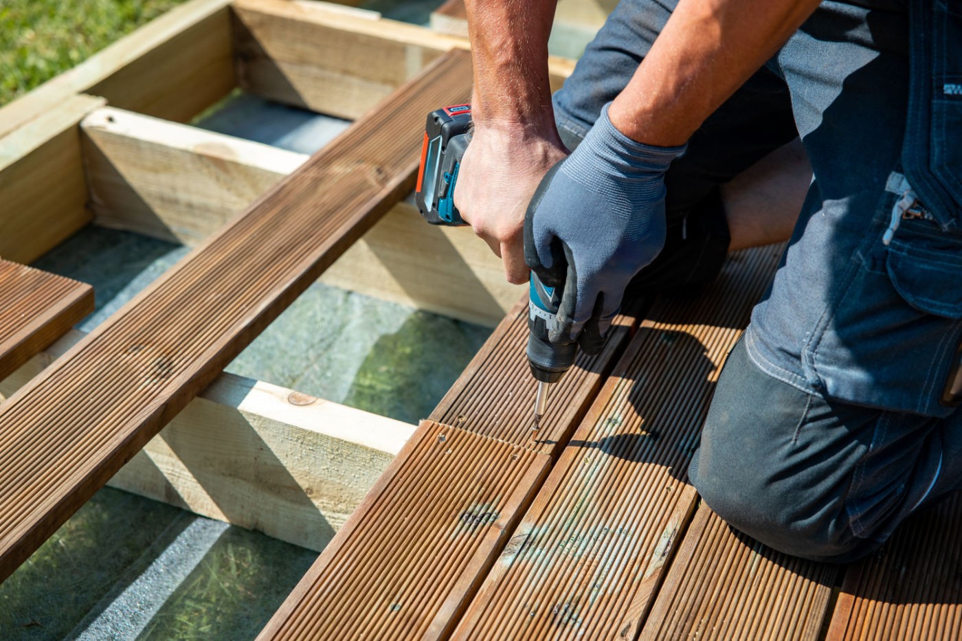 Deck Construction, Builder Hand With Electric Screwdriver Instal